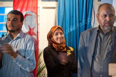 Soumaya Ghannouchi, Rached's daughter, watches the press conference in front of the Ennahda party headquarters; the crowd begins to gather as soon as the official announcement of the preliminary results declares Ennahda the winner.