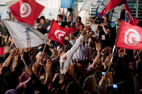 A crowd gathers in front of the Ennahdha party headquarters on election night.