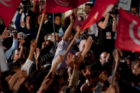 A crowd gathers in front of the Ennahdha party headquarters on election night.