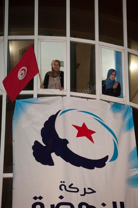 A crowd gathers in front of the Ennahdha party headquarters on election night.