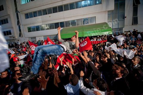 A crowd gathers in front of the Ennahdha party headquarters on election night.