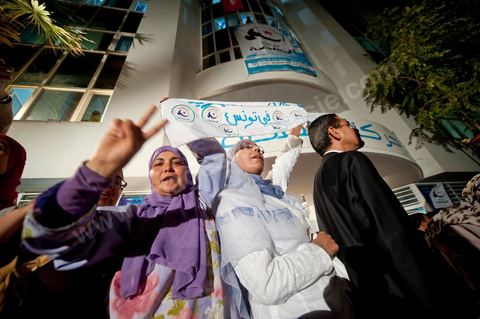 A crowd gathers in front of the Ennahdha party headquarters on election night.