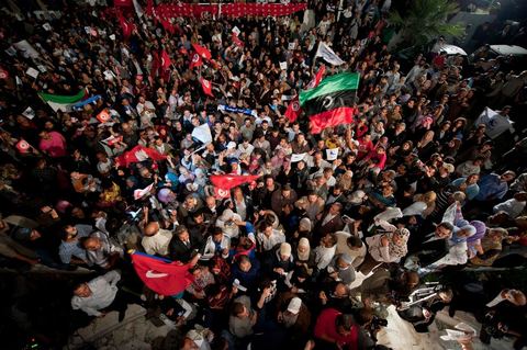 A crowd gathers in front of the Ennahdha party headquarters on election night.