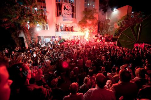 A crowd gathers in front of the Ennahdha party headquarters on election night.