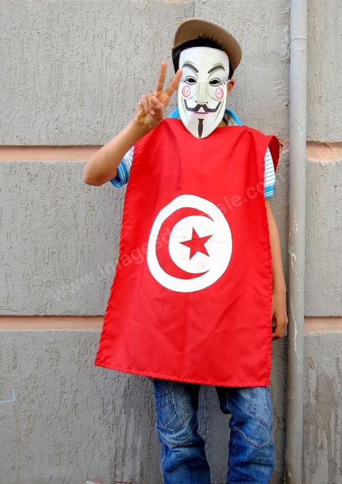 May 1, 2012, on Habib Bourguiba Avenue: Tunisian union members and workers march down the avenue to celebrate Labor Day. Children wearing Anonymous masks