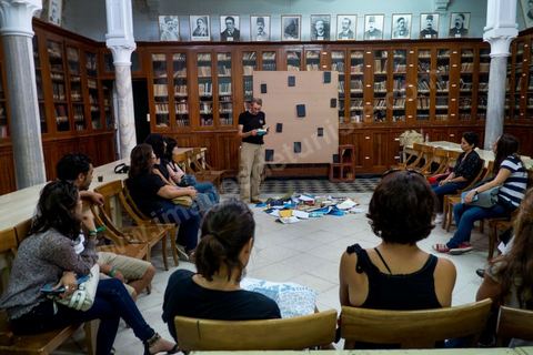 September 26, 2012: A performance reading by Mustapha Benfodil on the theme of the “anti-book” at the former National Library as part of Dream City 2012, “The Artist and Freedom,” held in the medina of Tunis from September 26 to 30. Beyond simply organizing an event in a public space, each edition of Dream City is the result of a collective research effort involving selected artists and specialists in art, urban studies, and the humanities.