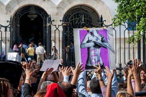 October 2, 2012: A rally organized by women’s and human rights groups took place in front of the Tunis courthouse in support of the Tunis couple who were summoned to appear before a judge this morning. The woman who was raped by police officers and her fiancé were questioned this morning by an investigating judge in Tunis, who must decide whether or not to charge her with “indecent exposure.” Following a questioning session lasting more than two hours conducted by Mohamed Ben Meftah, the victim’s lawyers said they were “optimistic” that the charges against their client and her fiancé for this offense—which carries a sentence of up to six months in prison—would be dropped. The investigating judge must decide in the coming hours or days whether to “dismiss the case or refer it to the appropriate court.”