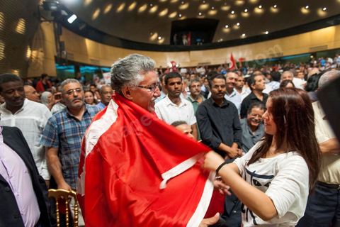 October 7, 2012: Hamma Hammami attended the major inaugural rally this Sunday to launch the Popular Front, the left-wing political party created following the unification of about ten left-wing parties under the leadership of figures such as Hamma Hammami and Chokri Belaïd.  “The Popular Front is the best alternative to govern the country during the next phase and achieve the goals of the revolution, thanks to its clear platform and high level of expertise,” stated Hamma Hammami, Secretary-General of the Tunisian Labor Party, who will be the Popular Front’s presidential candidate. “The Front will enter the upcoming elections armed with an effective monetary, fiscal, and social approach and real solutions to all the problems facing the Tunisian people.”