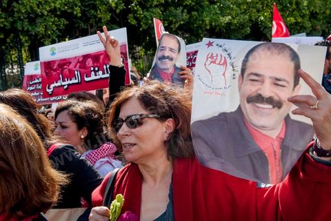 March 9, 2013: A woman holding a portrait of Chokri Belaid on Habib Bourguiba Avenue in Tunis; nearly 3,000 protesters gathered to commemorate Women’s Day and the death of Chokri Belaid on February 6. Several political figures, civil society activists, and artists answered the call from the UGTT Women’s Commission and other feminist organizations.