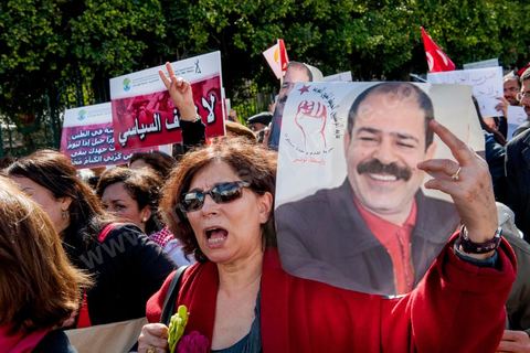 March 9, 2013: A woman holding a portrait of Chokri Belaid on Habib Bourguiba Avenue in Tunis; nearly 3,000 protesters gathered to commemorate Women’s Day and the death of Chokri Belaid on February 6. Several political figures, civil society activists, and artists answered the call from the UGTT Women’s Commission and other feminist organizations.