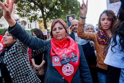 March 9, 2013: A woman holding a portrait of Chokri Belaid on Habib Bourguiba Avenue in Tunis; nearly 3,000 protesters gathered to commemorate Women’s Day and the death of Chokri Belaid on February 6. Several political figures, civil society activists, and artists answered the call from the UGTT Women’s Commission and other feminist organizations.