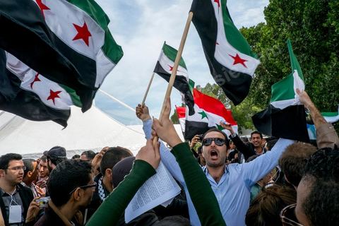 March 29, 2013: A highly tense standoff and minor clashes between pro-rebellion Syrians (flying the three-red-star flag) and Tunisian activists from the Bass Party, which supports Bashar al-Assad, took place in the central square of the WSF on the final day of the World Social Forum meetings on the Tunis university campus. This first forum held in the Arab world was strongly marked by Arab nationalist demands and statements, and dominated by a constant tribute to and support for the Palestinian people.