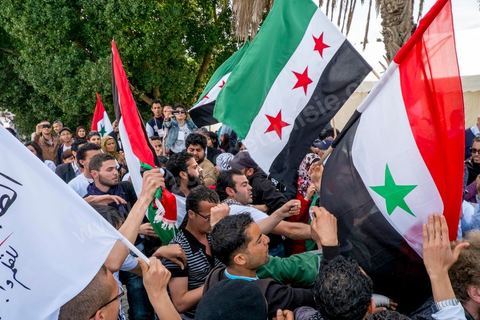 March 29, 2013: A highly tense standoff and minor clashes between pro-rebellion Syrians (flying the three-red-star flag) and Tunisian activists from the Bass Party, which supports Bashar al-Assad, took place in the central square of the WSF on the final day of the World Social Forum meetings on the Tunis university campus. This first forum held in the Arab world was strongly marked by Arab nationalist demands and statements, and dominated by a constant tribute to and support for the Palestinian people.