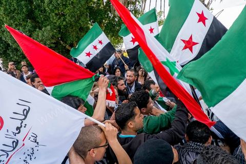 March 29, 2013: A highly tense standoff and minor clashes between pro-rebellion Syrians (flying the three-red-star flag) and Tunisian activists from the Bass Party, which supports Bashar al-Assad, took place in the central square of the WSF on the final day of the World Social Forum meetings on the Tunis university campus. This first forum held in the Arab world was strongly marked by Arab nationalist demands and statements, and dominated by a constant tribute to and support for the Palestinian people.