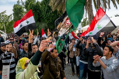 March 29, 2013: A highly tense standoff and minor clashes between pro-rebellion Syrians (flying the three-red-star flag) and Tunisian activists from the Bass Party, which supports Bashar al-Assad, took place in the central square of the WSF on the final day of the World Social Forum meetings on the Tunis university campus. This first forum held in the Arab world was strongly marked by Arab nationalist demands and statements, and dominated by a constant tribute to and support for the Palestinian people.