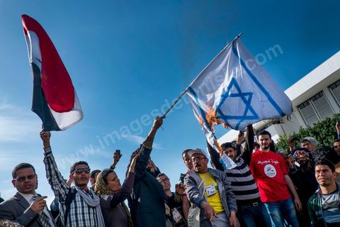 March 29, 2013: Tunisian activists from the “Bass pro Bashar al-Assad” party burned the Israeli flag in the central square of the World Social Forum on the final day of the World Social Forum meetings on the Tunis university campus. This first forum held in the Arab world was strongly marked by Arab nationalist demands and statements, and dominated by a constant tribute to and support for the Palestinian people.