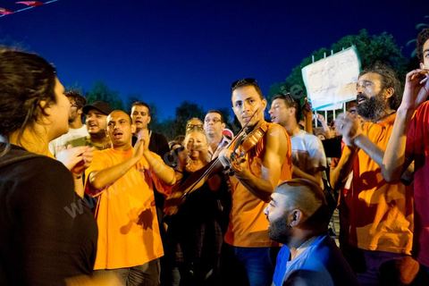 July 31, 2013: Amid the protesters, a mini-concert by the Atyists of the Movement of Revolutionary Creators. For the past four evenings, Tunisians have been gathering in the square in front of the National Assembly in the Bardo neighborhood of Tunis. Surrounding the nightly sit-ins by striking members of parliament, the public has been gathering to express their discontent following the assassination of MP Mohamed Brahmi and eight soldiers at Jebel Chambi.