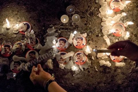 July 31, 2013: A candle in memory of the martyr Mohamed Brahim, who was assassinated on July 25. For the past four evenings, Tunisians have been gathering in the square in front of the National Assembly in the Bardo district of Tunis. Surrounding the nightly sit-ins held by striking members of parliament, the public has been gathering to express their outrage over the assassination of MP Mohamed Brahmi and eight soldiers at Jebel Chambi.