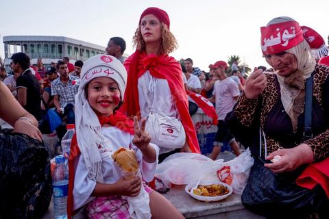 August 6, 2013: Breaking the fast during the mass rally in support of the lawmakers staging a sit-in, for a grand evening event honoring the martyrs. On this evening marking the six-month anniversary of the assassination of Chokri Belaid, nearly 60,000 opponents of the regime gathered.