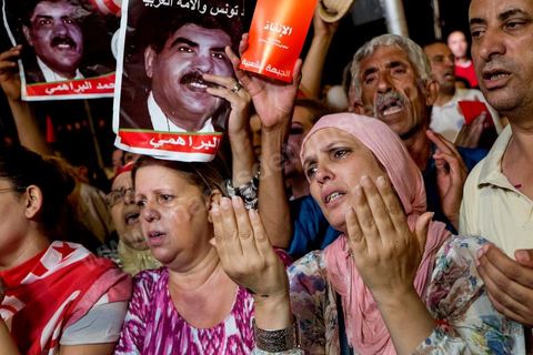 August 6, 2013: People of all generations were deeply moved during the prayer for the martyrs at the mass rally held in support of the lawmakers on sit-in, as part of a grand evening tribute to the martyrs. On this evening marking the six-month anniversary of Chokri Belaid’s assassination, nearly 60,000 opponents of the regime gathered.