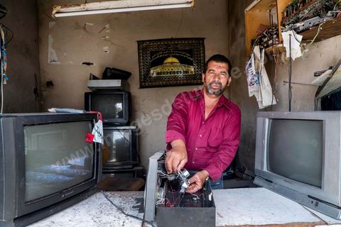 Ahmed in his TV repair shop. At the home of Ahmed and Janet RIHIME in the Kabaria neighborhood. These parents have been searching for their 19-year-old son, Wissem, since March 2011. The tragedy struck this family twice when Janet, the mother, driven by despair, set herself on fire a few months ago.