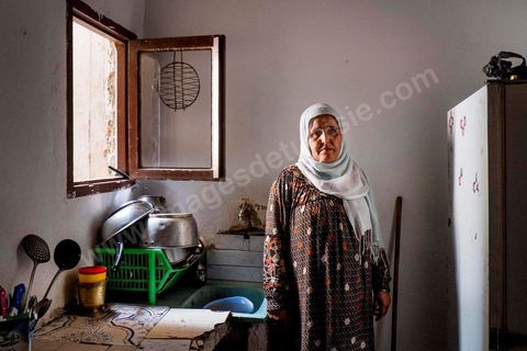 Rebh in her kitchen. At the home of Rebh and Abdelhamid Bouthouri, the parents of Ibrahim, who went missing in March 2011 in the Kabaria neighborhood.