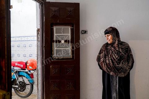 Omelkhir’s grandmother came to live with her daughter to help her. At Omelkhir Ouiretani’s home, this young mother of two is searching for her husband, Nabil, who went missing on the boat on March 29, 2011, in the Kabaria neighborhood.