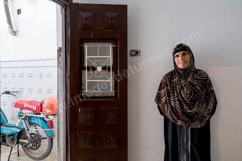 Omelkhir’s grandmother came to live with her daughter to help her. At Omelkhir Ouiretani’s home, this young mother of two is searching for her husband, Nabil, who went missing on the boat on March 29, 2011, in the Kabaria neighborhood.