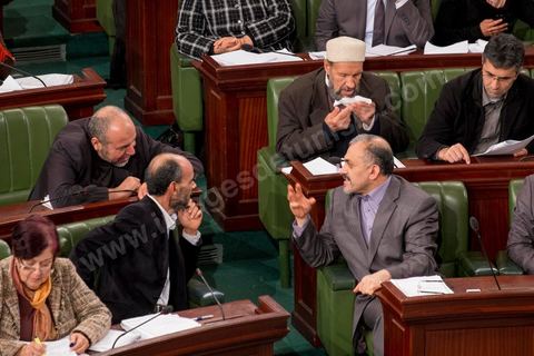 January 14, 2014: Ennahdha representative Ameur Laryedh at the National Constituent Assembly; representatives continue to review and vote on the articles of the constitution. On the anniversary of the Revolution, the president of the National Constituent Assembly had hoped to finalize the constitution on this commemorative day; unfortunately, heated debates are causing delays. 