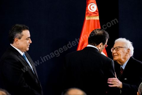 January 29, 2014: Ali Larayedh and Mehdi Jomaa welcoming political figures—here, Mustapha Filali—at the handover ceremony between the two governments, led by outgoing Prime Minister Ali Larayedh and new Prime Minister Mehdi Jomaa. All members of the outgoing and incoming governments were present, as well as political party leaders and other political figures. 