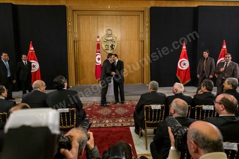 Mehdi Jomaa and Ali Laaraeydh at the handover ceremony for the position of Head of Government at Dar Dhiafa on January 29, 2014.