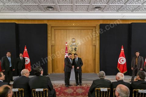 Mehdi Jomaa and Ali Laaraeydh at the handover ceremony for the position of Head of Government at Dar Dhiafa on January 29, 2014.
