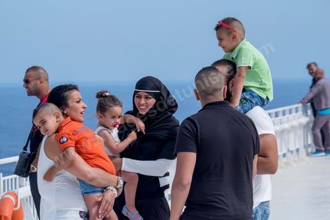 Passengers on the bridge in the approach of Tunisia. Aboard the new vessel Tanit de la CTN (Tunisian Company of Navigation) going Marseille to Tunis. The return of the Tunisian immigrants in France every summer represents a tourist and financial basket very important for Tunisia. The number of Tunisians of the foreigner would be close to 1,5 millions that is 13 % of the Tunisian population, are 60 % to be lived in France and 82 % in Europe, The summer represents 55 % of the 1,75 million Tunisians' annual entrances of the foreigner.
