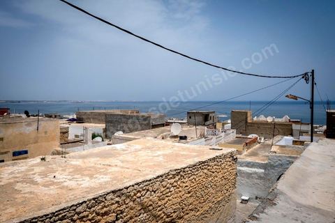 June 24, 2014: On the roof of Mohamed’s house in the medina of Ksibet, on the coast. Mohamed, a fishing boat captain in Ksibet El Mediouni near Monastir, smuggled hundreds of young undocumented migrants between Tunisia and Sicily between 1996 and 2002. Sentenced to six and a half years in prison, he has now resumed his work as a fishing boat captain. 