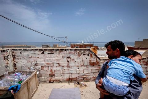 June 24, 2014: On the roof of Mohamed’s house in the medina of Ksibet, on the coast. Mohamed, a fishing boat captain in Ksibet El Mediouni near Monastir, smuggled hundreds of young undocumented migrants between Tunisia and Sicily between 1996 and 2002. Sentenced to six and a half years in prison, he has now resumed his work as a fishing boat captain. 
