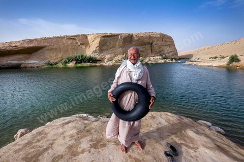Belgacem came with some friends to go swimming in the lake at "Gafsa Beach." Since he didn't know how to swim, he made a float out of an inner tube.