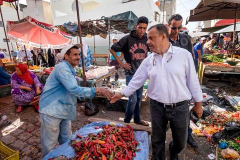 October 16, 2014: Samir Taieb, a member of the National Constituent Assembly (ANC) and the lead candidate on the Tunis 1 list for the Union for Tunisia (UPT) party in the legislative elections, campaigning at the Kabaria market. Kabaria is one of the most disadvantaged neighborhoods in the southern suburbs of Tunis; social tensions and grievances are widespread in these neighborhoods, where residents are often disillusioned with politics. Grassroots outreach has the merit of giving them hope and convincing them to go to the polls. 