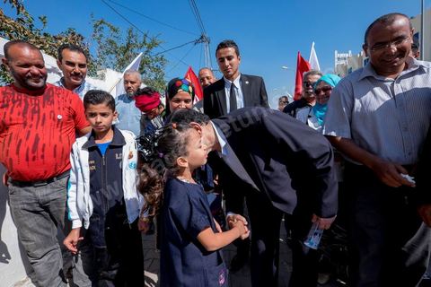 20 ocotbre 2014 : Ali Larayedh, candidat en tête de liste du parti islamiste Ennahdha sur Tunis 1, en campagne pour les élections legislatives du 26 octobre 2014 dans le quartier populaire de Hrairia dans la banlieue ouest de Tunis. 