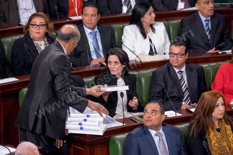 December 2, 2014: Distribution of copies of the Quran for the swearing-in ceremony of members of parliament. First meeting of the 217 members of the Assembly of the Representatives of the People (ARP) elected on October 26, an election won by the Nidaa Tounès party (86 seats) ahead of the Islamist Ennahda party (69 seats), which had held a majority until then. This first meeting was presided over by longtime activist Ali Ben Salem, in his capacity as the senior-most member of this new assembly.