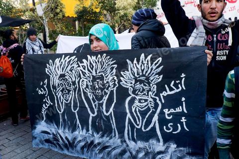 January 14, 2015: About 50 young Islamists from the Kram League for the Protection of the Revolution came to wave banners reading “I am not Charlie” or “I am Muhammad.” Tunisians gathered on Habib Bourguiba Avenue in Tunis to celebrate the fourth anniversary of the Tunisian revolution, which led to the ouster of former President Zine el Abdidine Ben Ali on Friday, January 14, 2011, and his exile to Saudi Arabia. Among the many Tunisians who came to march with their families under mild sunshine, a wide variety of groups were scattered along the avenue: families of martyrs, supporters of Hizb ut-Tahrir, Ennahda, or El Watan, Islamist youth from the LPR, and supporters of Sofiane and Nadhir, ...