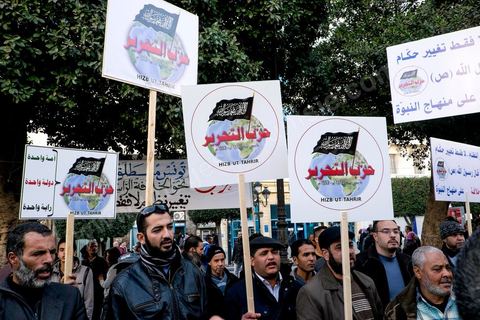 January 14, 2015: The Hezb Ut-Tahrir party, legalized in 2012 by Jebali, even though it does not recognize the concept of a republic. Tunisians celebrated on Habib Bourguiba Avenue in Tunis the fourth anniversary of the Tunisian revolution that led to the fall of ousted President Zine el Abdidine Ben Ali on Friday, January 14, 2011, and his exile to Saudi Arabia. Among the many Tunisians who came to march with their families under a gentle sun, a wide variety of groups were spread out along the avenue: families of martyrs, supporters of Hizb al-Tahrir, Ennahda, or El Watan, the Islamist youth of the LPR, and supporters of Sofiane and Nadhir, ...