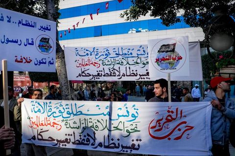 January 14, 2015: The Hezb Ut-Tahrir party, legalized in 2012 by Jebali, even though it does not recognize the concept of a republic. Tunisians celebrated on Habib Bourguiba Avenue in Tunis the fourth anniversary of the Tunisian revolution that led to the fall of ousted President Zine el Abdidine Ben Ali on Friday, January 14, 2011, and his exile to Saudi Arabia. Among the many Tunisians who came to march with their families under a gentle sun, a wide variety of groups were spread out along the avenue: families of martyrs, supporters of Hizb al-Tahrir, Ennahda, or El Watan, the Islamist youth of the LPR, and supporters of Sofiane and Nadhir, ...