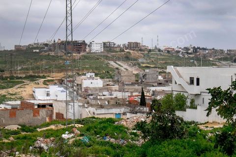 Yassine Abidi, l'un des deux terroristes abattus de l'attque du musée du Bardo, vivait dans une nouvelle cité située en haut d'une colline entre les quartiers populaires de l'ouest de Tunis et les nouveaux quartiers huppés.
