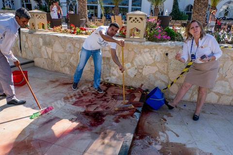 June 26, 2015: While shocked tourists continue to mill around the pool area, where hotel employees are cleaning up large amounts of blood.  Terrorist attack at a hotel in the tourist area of Port El Kantaoui, north of Sousse. A young Tunisian terrorist opened fire for nearly half an hour on tourists, from the hotel beach all the way to the reception area, leaving a preliminary death toll of 39 among tourists and Tunisian employees, before being shot dead by security forces. The Tunisian Ministry of Health states that among the injured are people of British, Belgian, German, and Norwegian nationalities, among others.