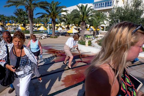 June 26, 2015: While shocked tourists continue to mill around the pool area, where hotel employees are cleaning up large amounts of blood.  Terrorist attack at a hotel in the tourist area of Port El Kantaoui, north of Sousse. A young Tunisian terrorist opened fire for nearly half an hour on tourists, from the hotel beach all the way to the reception area, leaving a preliminary death toll of 39 among tourists and Tunisian employees, before being shot dead by security forces. The Tunisian Ministry of Health states that among the injured are people of British, Belgian, German, and Norwegian nationalities, among others.