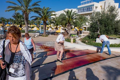 June 26, 2015: While shocked tourists continue to mill around the pool area, where hotel employees are cleaning up large amounts of blood.  Terrorist attack at a hotel in the tourist area of Port El Kantaoui, north of Sousse. A young Tunisian terrorist opened fire for nearly half an hour on tourists, from the hotel beach all the way to the reception area, leaving a preliminary death toll of 39 among tourists and Tunisian employees, before being shot dead by security forces. The Tunisian Ministry of Health states that among the injured are people of British, Belgian, German, and Norwegian nationalities, among others.