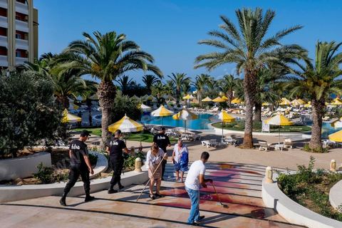 June 26, 2015: While shocked tourists continue to mill around the pool area, where hotel employees are cleaning up large amounts of blood.  Terrorist attack at a hotel in the tourist area of Port El Kantaoui, north of Sousse. A young Tunisian terrorist opened fire for nearly half an hour on tourists, from the hotel beach all the way to the reception area, leaving a preliminary death toll of 39 among tourists and Tunisian employees, before being shot dead by security forces. The Tunisian Ministry of Health states that among the injured are people of British, Belgian, German, and Norwegian nationalities, among others.