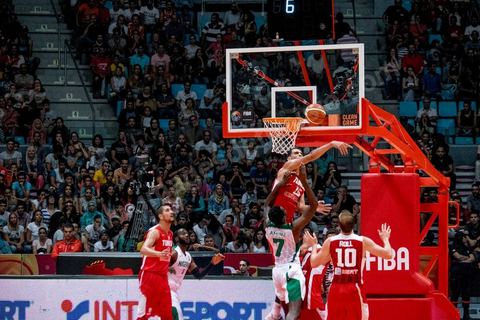 August 23, 2015: Salah Mejri, Tunisia’s famous No. 15, dominates the game at 2.17m; he has just been signed by the Dallas Mavericks and becomes the first Arab player in the NBA. Tunisia’s final group stage game against Nigeria at AfroBasket Tunisia 2015. Tunisia won (70–59) and finished first in its group.