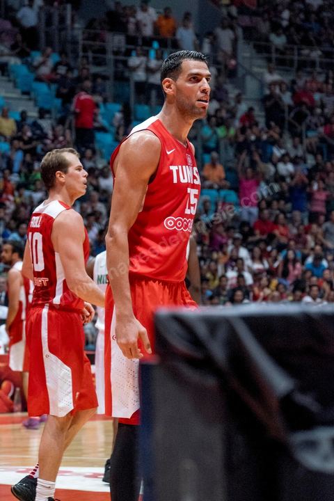 August 23, 2015: Salah Mejri, Tunisia’s famous No. 15, dominates the game at 2.17m; he has just been signed by the Dallas Mavericks and becomes the first Arab player in the NBA. Tunisia’s final group stage game against Nigeria at AfroBasket Tunisia 2015. Tunisia won (70–59) and finished first in its group.