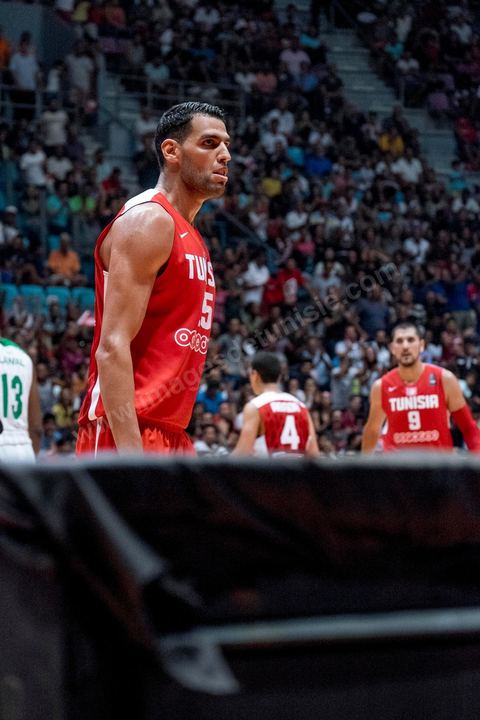 August 23, 2015: Salah Mejri, Tunisia’s famous No. 15, dominates the game at 2.17m; he has just been signed by the Dallas Mavericks and becomes the first Arab player in the NBA. Tunisia’s final group stage game against Nigeria at AfroBasket Tunisia 2015. Tunisia won (70–59) and finished first in its group.